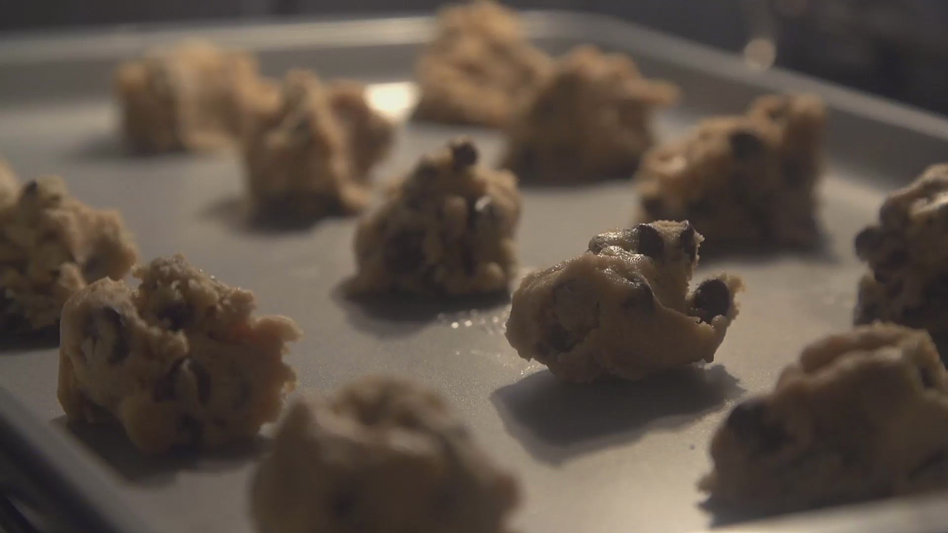 Load video: slow motion of cookies baking in oven